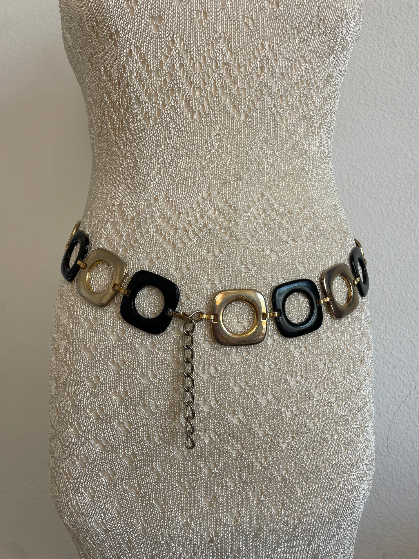 Stylish vintage 2000s metal belt in a trendy black and gold design