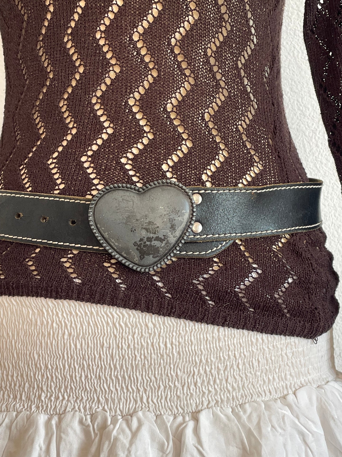 Stylish vintage Y2K leather belt in black with a metal heart-shaped buckle