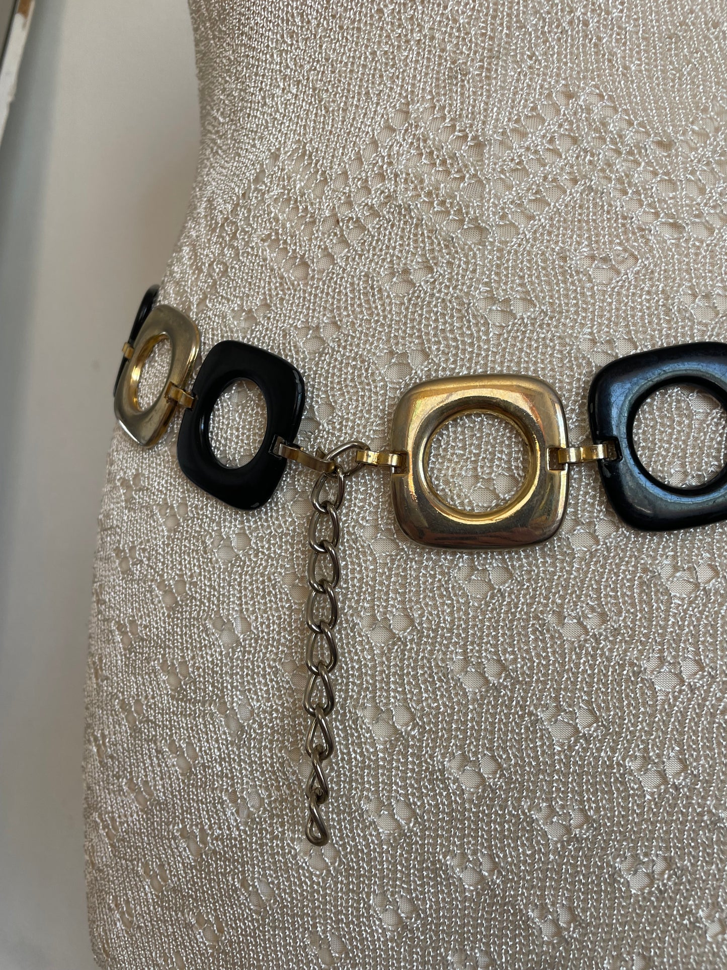 Stylish vintage 2000s metal belt in a trendy black and gold design