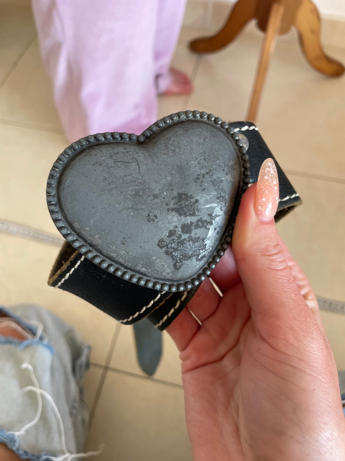 Stylish vintage Y2K leather belt in black with a metal heart-shaped buckle